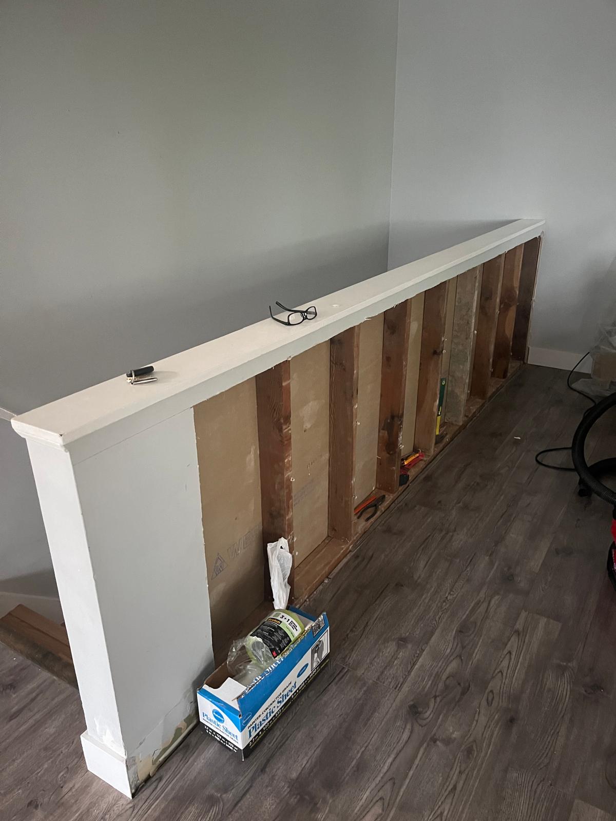 Staircase before — open stud wall